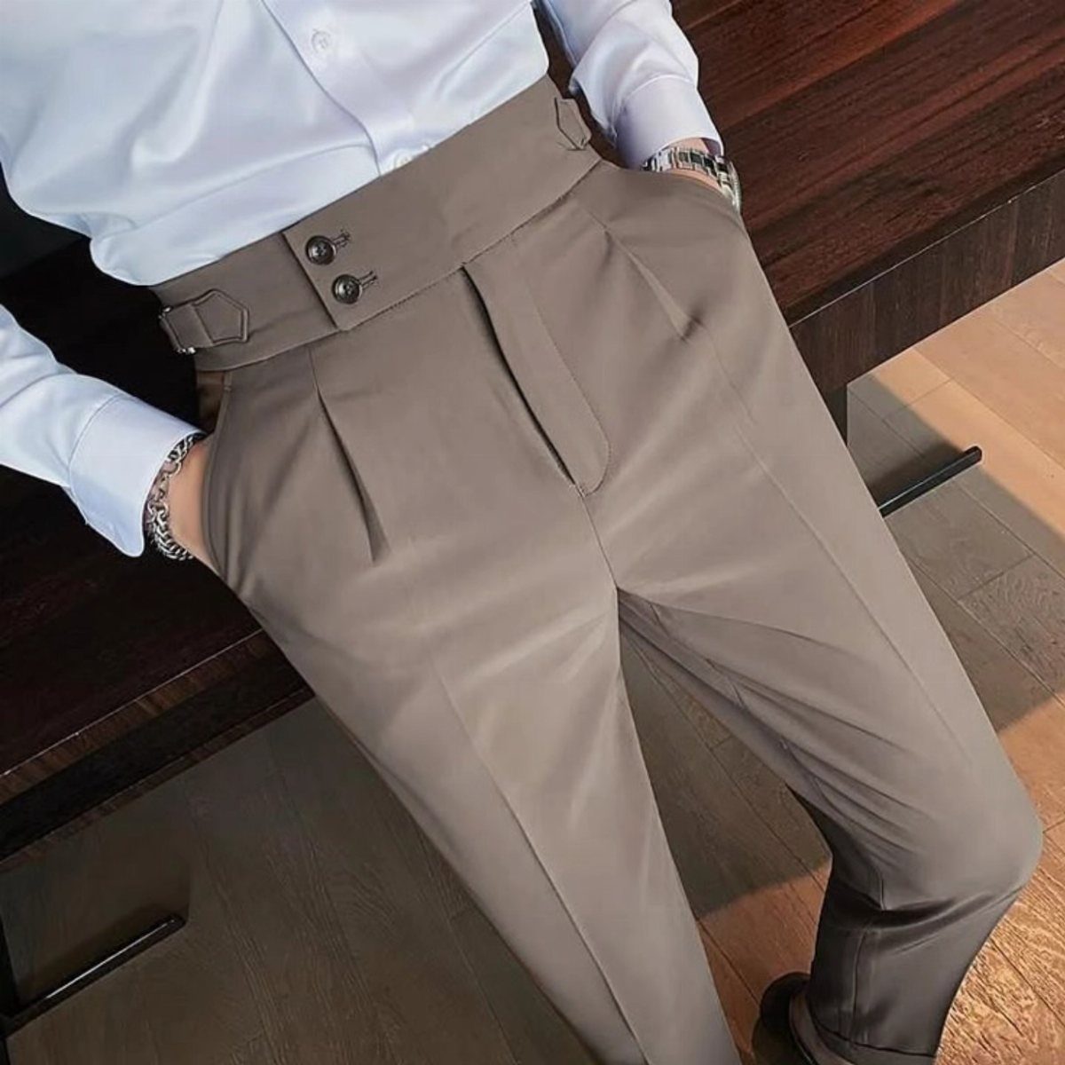 Taupe dress pants with pleats and a high waist paired with white shirt